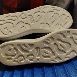 A brand new black and white size 45 Alexander McQueen shoe for men